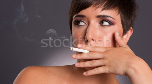 Young Woman Inhales Cigarette Smoke INtimate Smoker Portrait Stock photo © cboswell