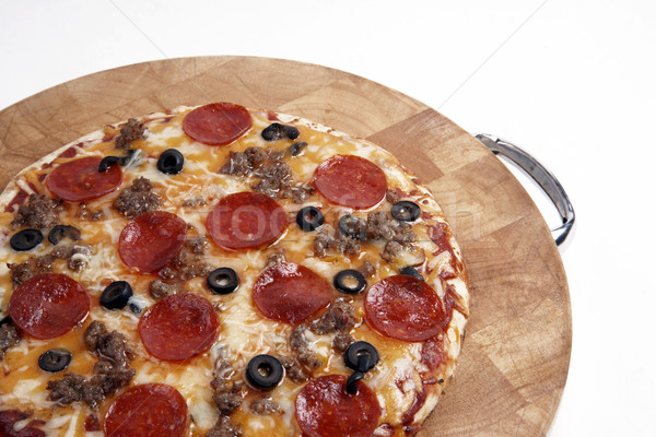 Pizza deska do krojenia żywności oliwy pie Zdjęcia stock © cboswell