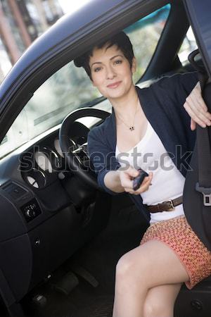 Attractive Determined Business Woman Traveler Enters Taxi Cab Stock photo © cboswell