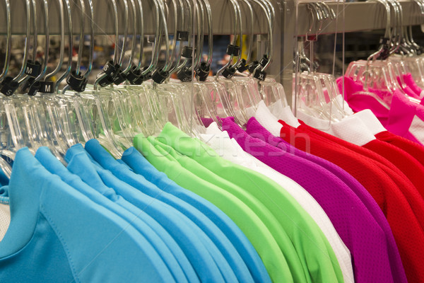 Retail Store Clothing Rack Plastic Hangers Fashion Apparel Vibra Stock photo © cboswell