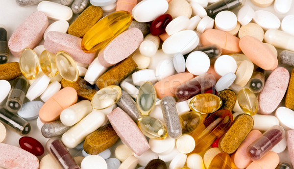 Vitamin Supplement Pills Capsules Pile Group Treatment Medicatio Stock photo © cboswell