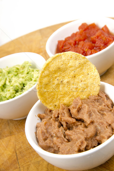 Food Appetizers Chips Salsa Refried Beans Guacamole Wood Cutting Stock photo © cboswell