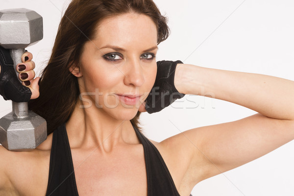 Attractive Brunette Woman Working Out Curling Barbells White Bac Stock photo © cboswell