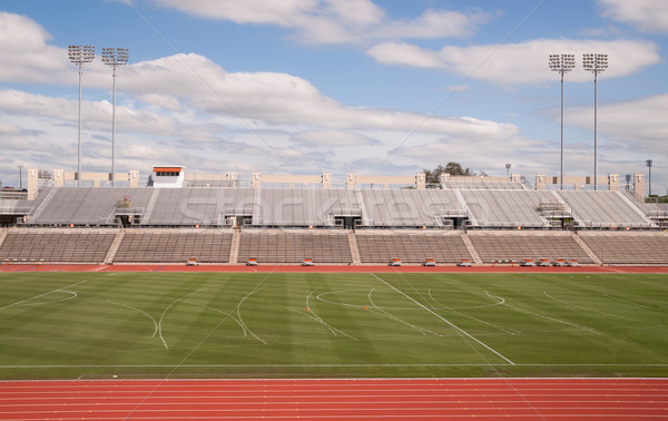 College Level Track Stadium Puffy Clouds Blue Sky Stock photo © cboswell