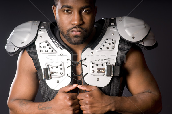 Football Player in Shoulder Pads Stock photo © cboswell