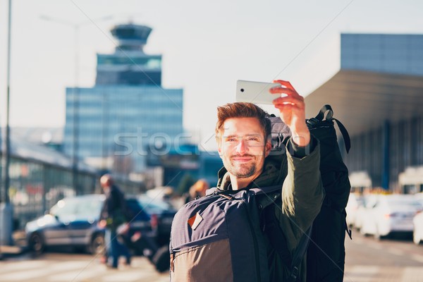 Traveler taking a selfie at the airport Stock photo © Chalabala
