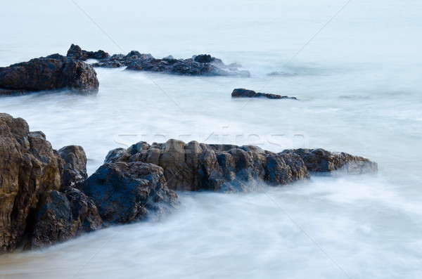Sea waves lash line impact rock Stock photo © chatchai