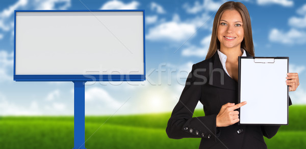 Businesswoman holding paper holder Stock photo © cherezoff