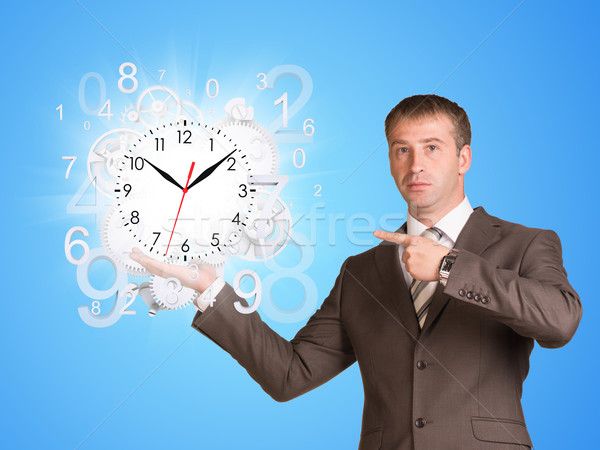 Imprenditore tenere clock battenti business mano Foto d'archivio © cherezoff