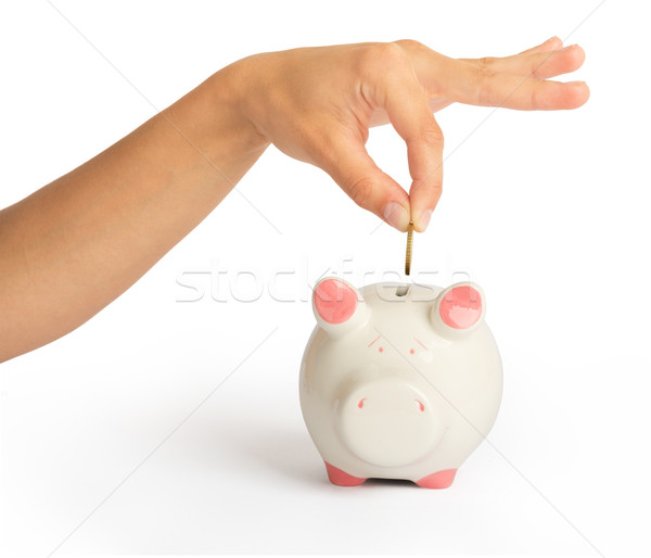 Piggy bank with humans hand Stock photo © cherezoff