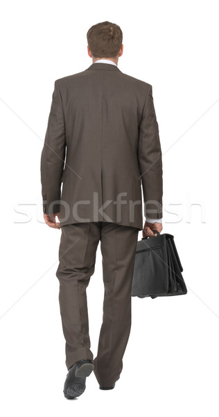 Businessman with suitcase walking Stock photo © cherezoff