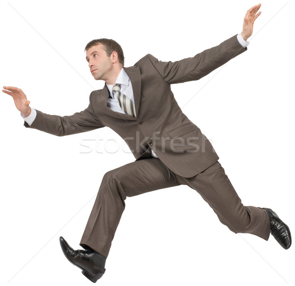 Businessman in suit running fast on white Stock photo © cherezoff