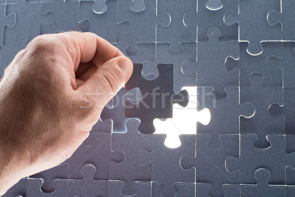 Missing jigsaw puzzle piece with light glow Stock photo © cherezoff