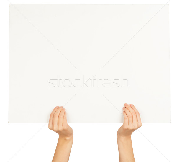 Womans hands holding horizontal empty card Stock photo © cherezoff