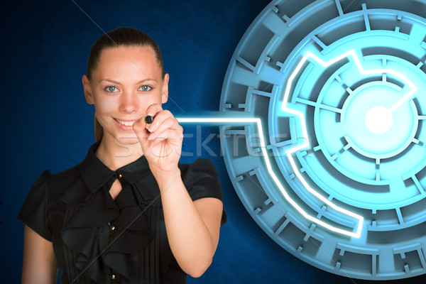 Businesswoman writing on holographic screen Stock photo © cherezoff