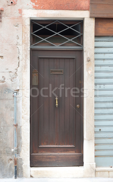 Wooden door in wall Stock photo © cherezoff