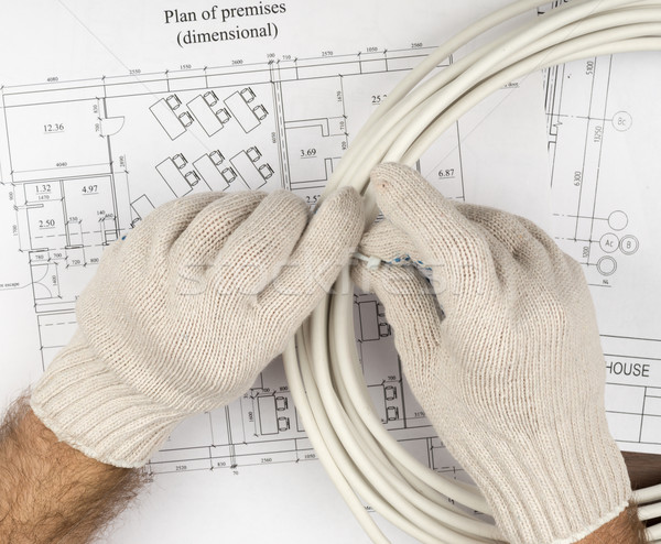 Mans hands fixing wires Stock photo © cherezoff