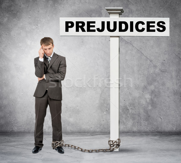 Businessman word prejudice on post sign Stock photo © cherezoff