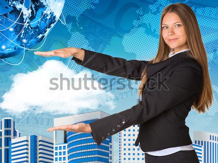 Businesswoman with pen looking at camera Stock photo © cherezoff