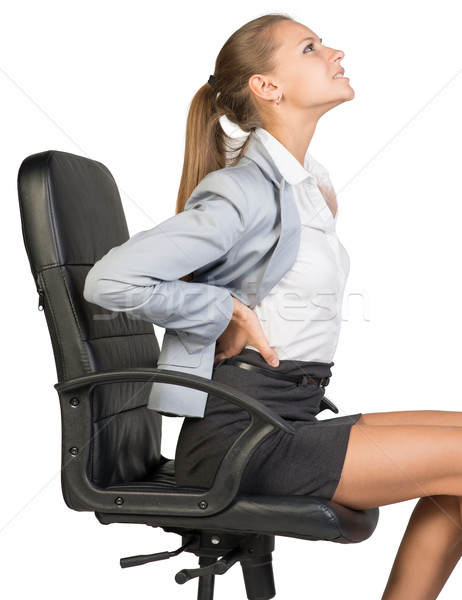 Mujer de negocios bajar dolor de espalda sesión silla de oficina aislado Foto stock © cherezoff