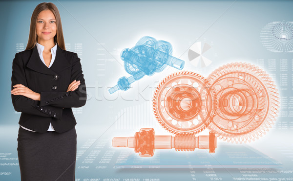 Businesswoman with wire frame gears Stock photo © cherezoff