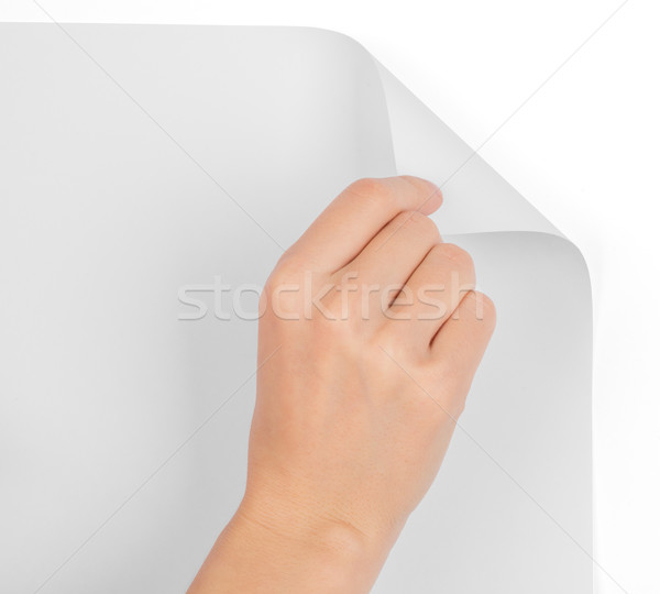 Womans hand turning blank page Stock photo © cherezoff