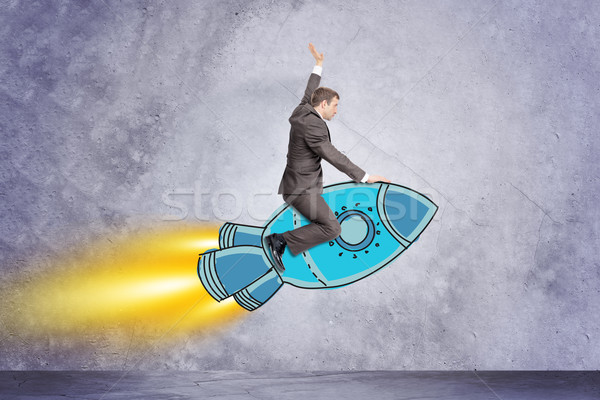üzletember repülés rakéta rajzolt szürke fal Stock fotó © cherezoff