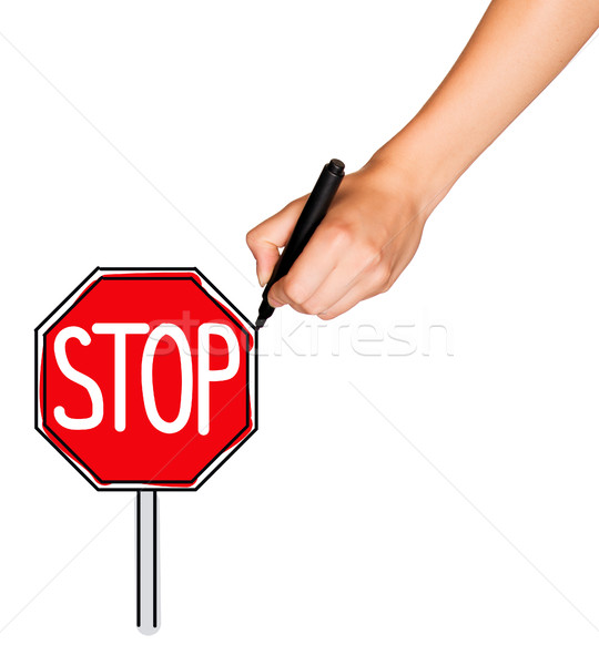A female hand holds marker and draws stop sign Stock photo © cherezoff