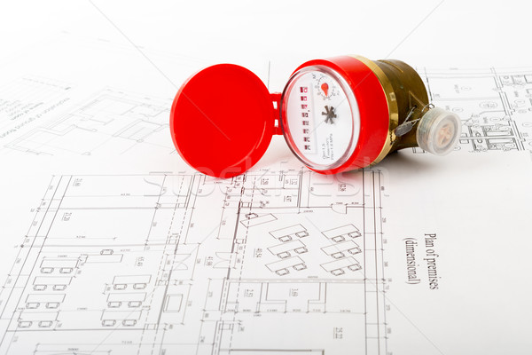 Red water meter on draft Stock photo © cherezoff