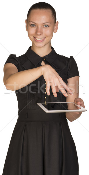 Beautiful girl in dress holding tablet and covers it Stock photo © cherezoff