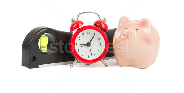 Builders level with piggy bank Stock photo © cherezoff