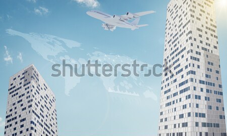 Wolkenkrabber jet zon business wolken stad Stockfoto © cherezoff