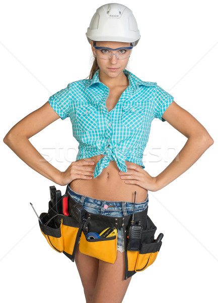 Woman in hard hat, tool belt and protective glasses Stock photo © cherezoff