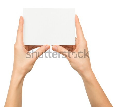 Womans right hand holding blank paper Stock photo © cherezoff