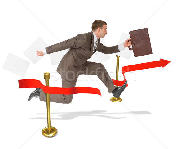 Businessman with suitcase finishing Stock photo © cherezoff