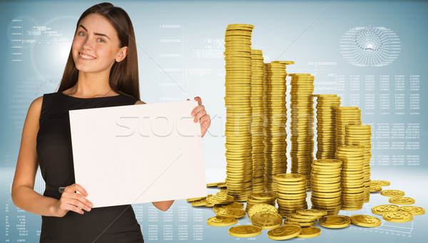 Business woman utrzymać pusty papieru piramidy złote monety Zdjęcia stock © cherezoff