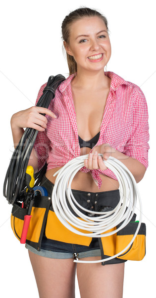 Woman in tool belt holding coils of cable Stock photo © cherezoff