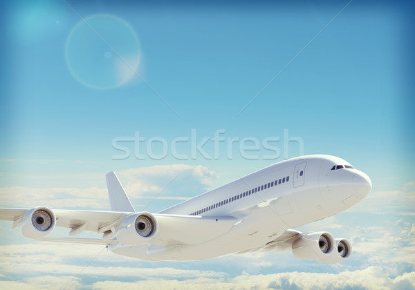 Jet in sky with clouds Stock photo © cherezoff