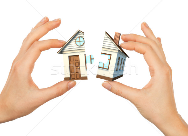 Womans hand making house puzzle Stock photo © cherezoff