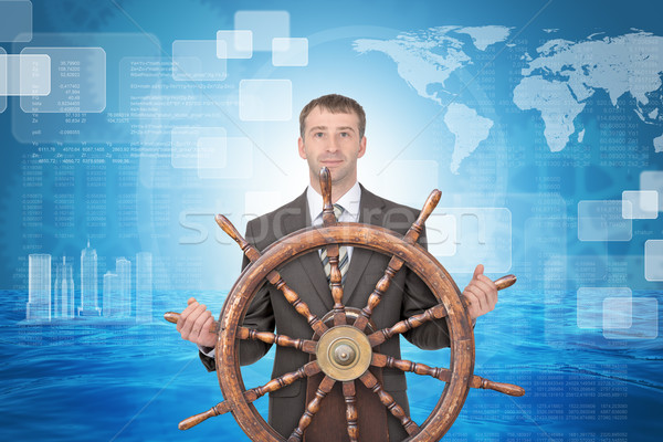Stock photo: Smiling businessman with steering wheel and sea