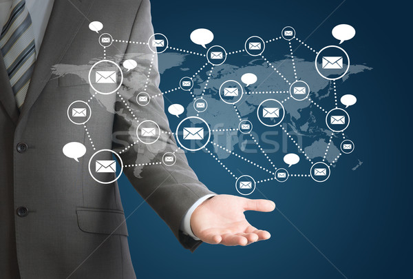 Businessman and network of contacts on hand Stock photo © cherezoff