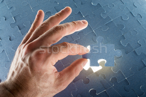 Missing jigsaw puzzle piece with light glow Stock photo © cherezoff