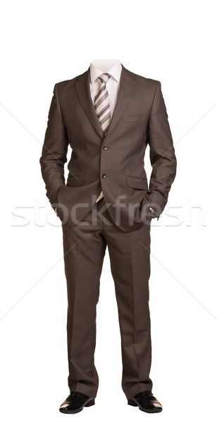 Businessman without head, standing with hands in pockets. Isolated Stock photo © cherezoff