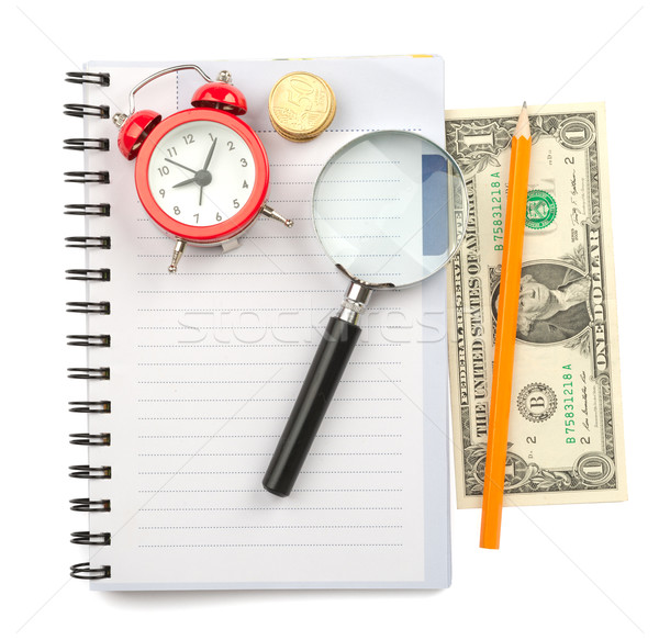 Copybook with loupe and coins Stock photo © cherezoff