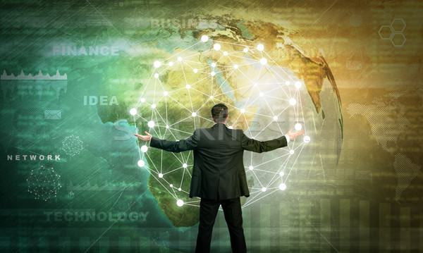 ビジネスマン ホログラフィック 画面 地球 世界中 要素 ストックフォト © cherezoff