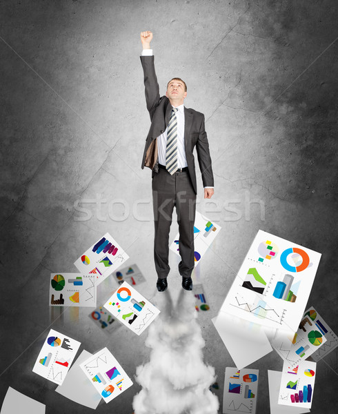 Businessman flying up Stock photo © cherezoff