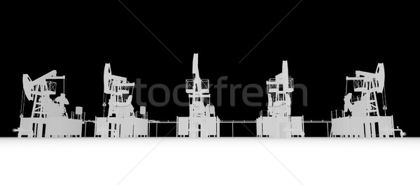 Gray silhuettes of oil pump-jacks. Front view Stock photo © cherezoff