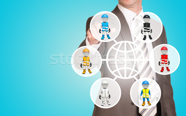 Businessman pressing on holographic screen Stock photo © cherezoff