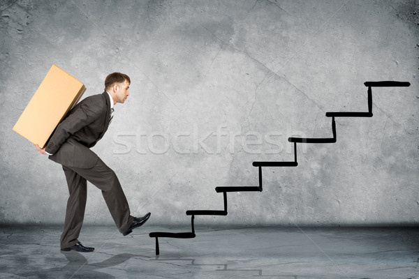 Middle aged business man with difficult task Stock photo © cherezoff