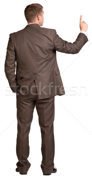 Businessman holding hand up in front of him Stock photo © cherezoff